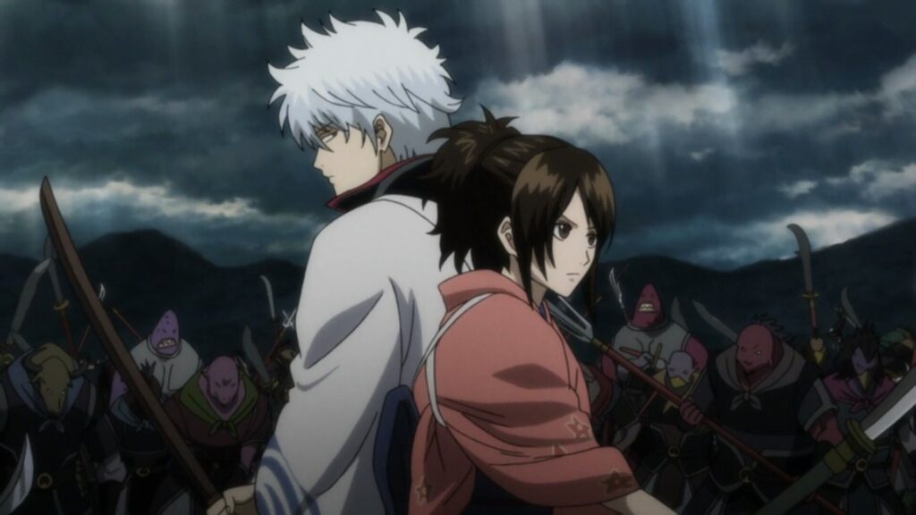 Gintoki and Tae standing back to back about to fight