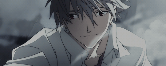 Kaworu smiling as his white hair and shirt flow in the wing.